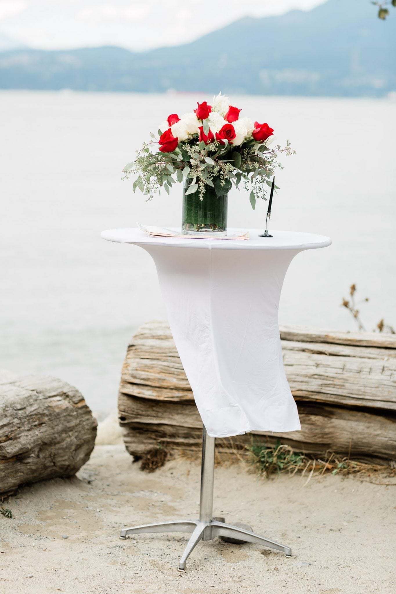 Wedding ceremony table with a bouquet | Vancouver wedding photographer