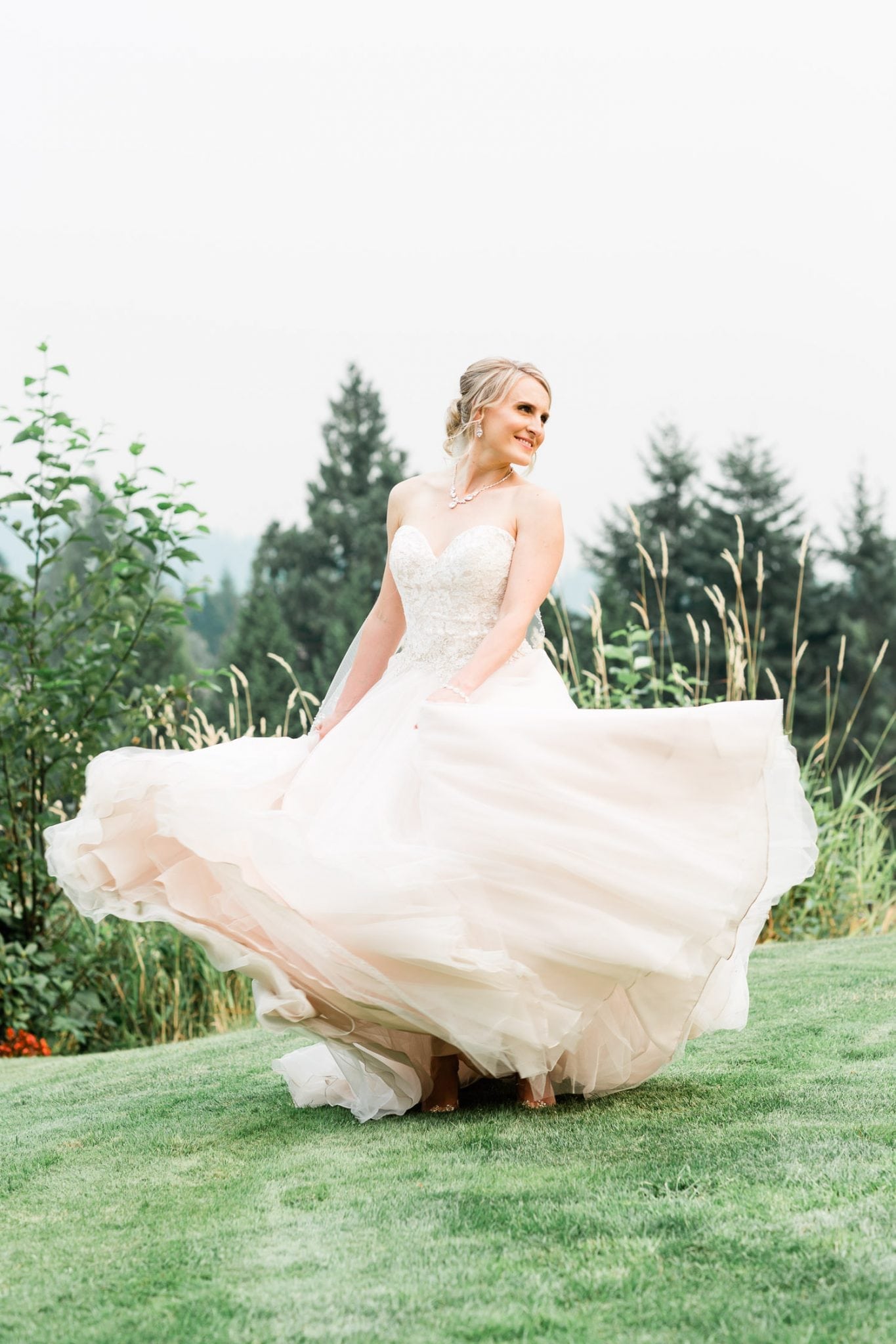 Bride portrait dancing on the grass | Vancouver wedding photographer | Westwood Plateau Golf Club Wedding