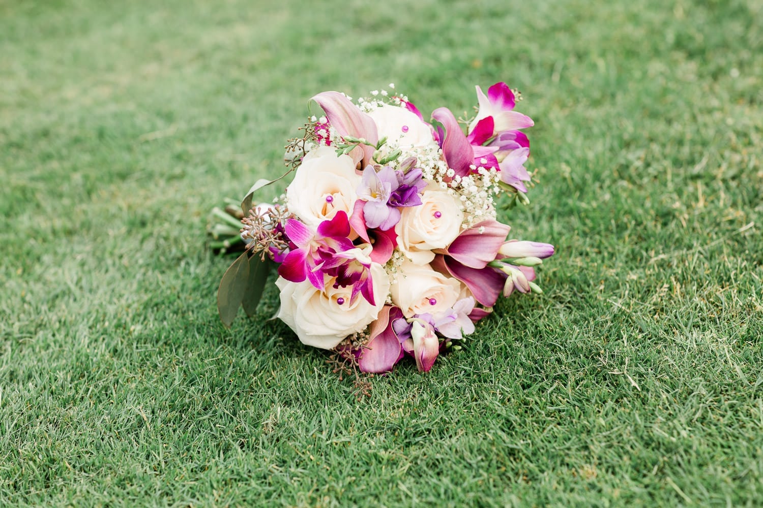 Wedding bouquet on the grass | Vancouver wedding photographer | Westwood Plateau Golf Club Wedding
