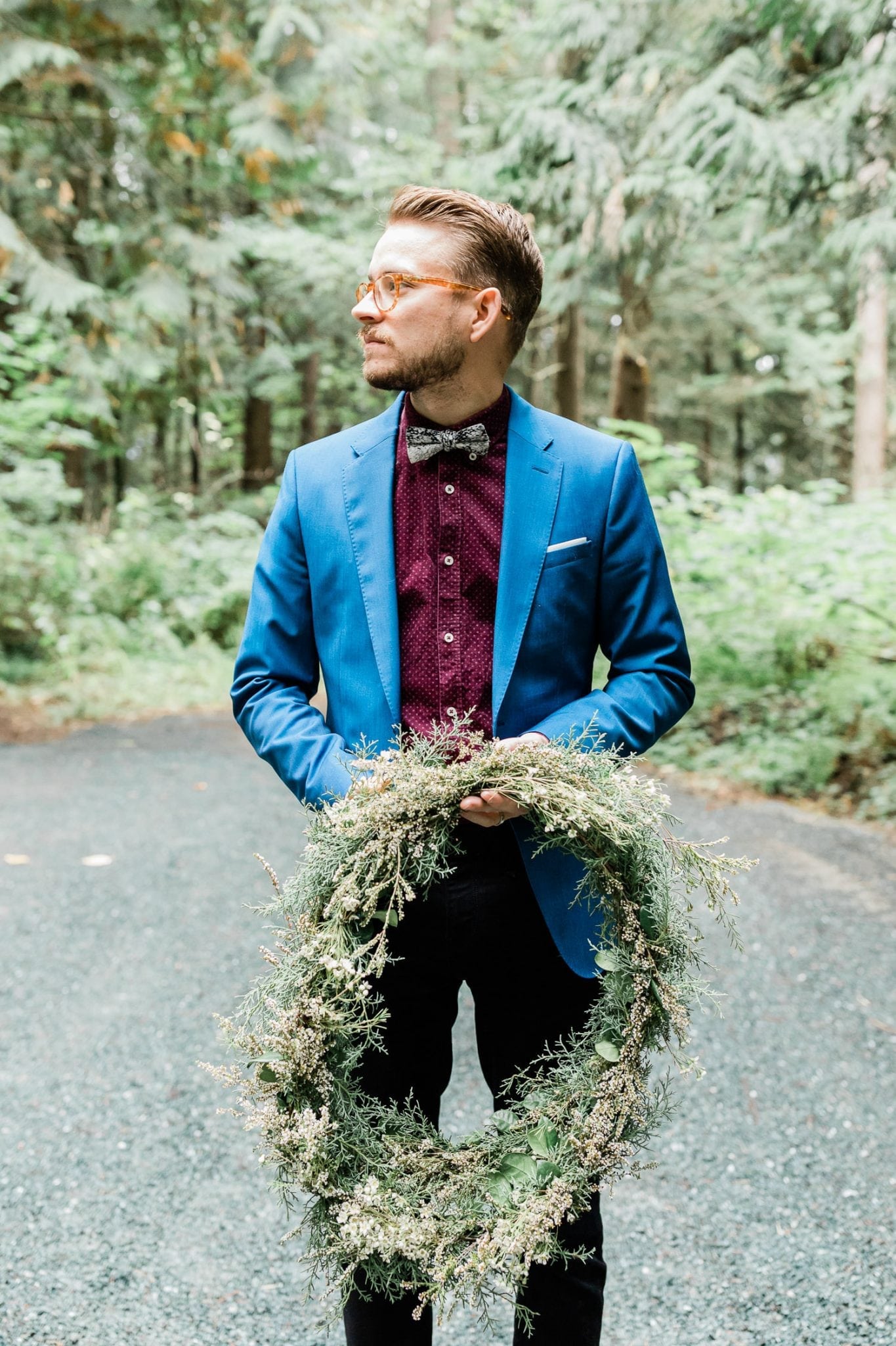 Wedding guest holding wreath | Vancouver wedding photographer