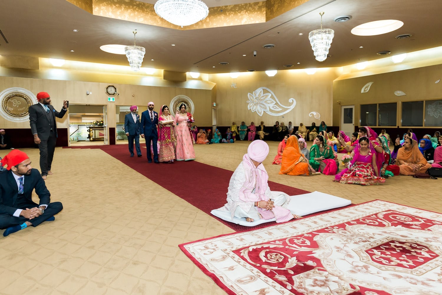 Indian groom seeing bride for the first time at the temple | Indian wedding photography Vancouver